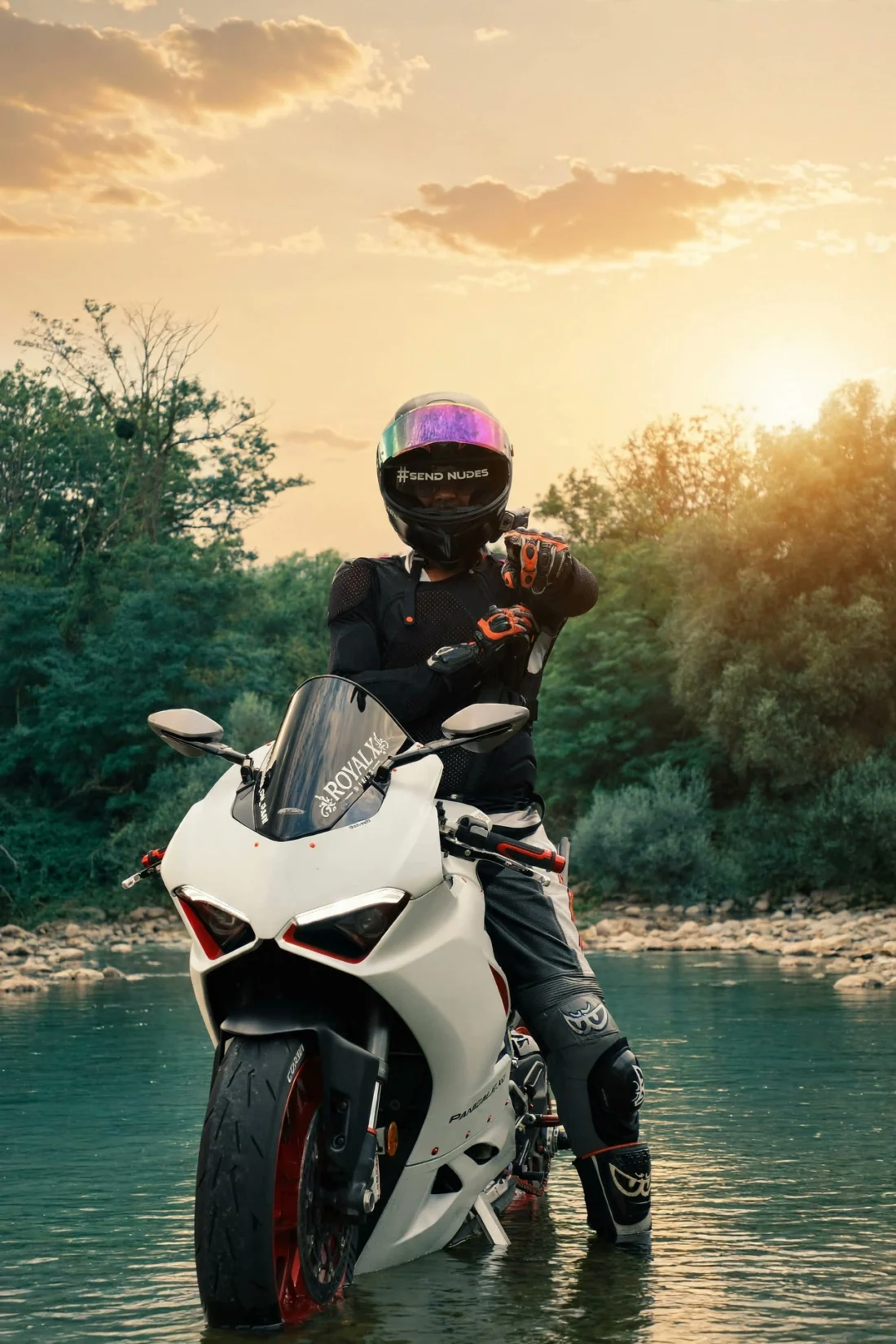 Rider facing the sunset on the Panigale