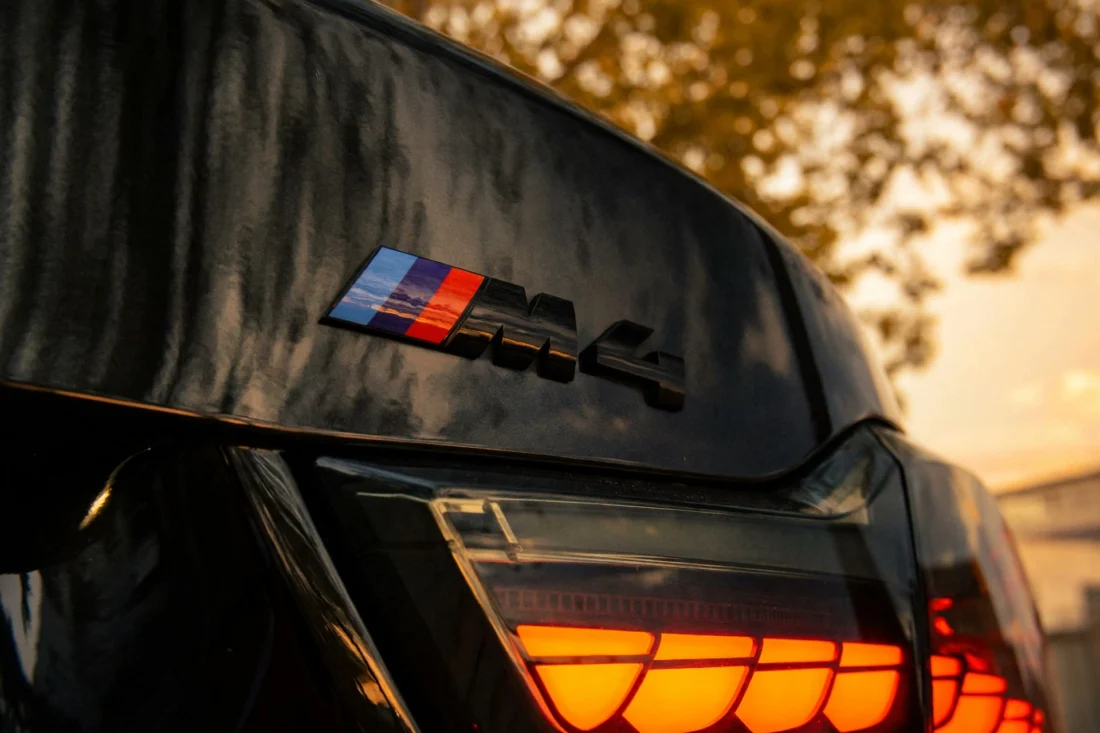 M4 badge and taillight in the sunset