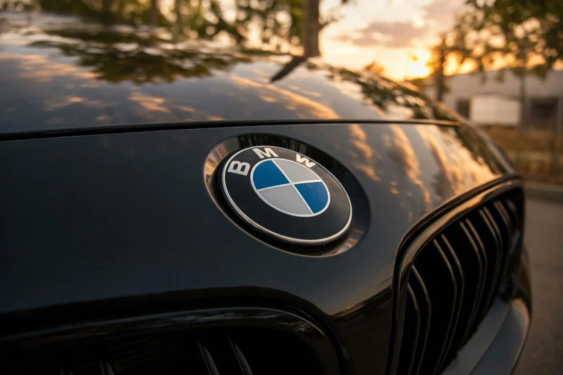 BMW hood badge in golden light