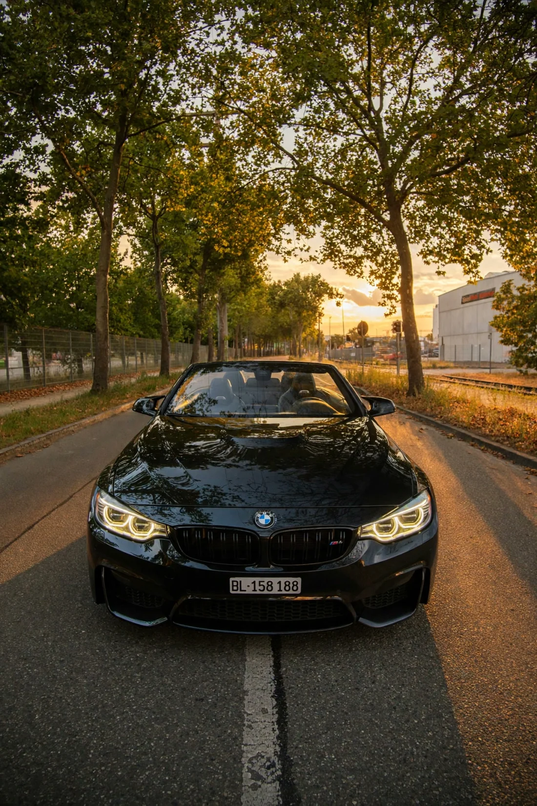 M4 front view on the avenue, headlights on