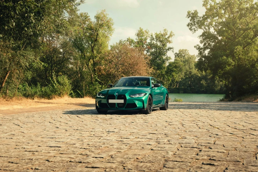 Isle of Man green BMW M4 by the water